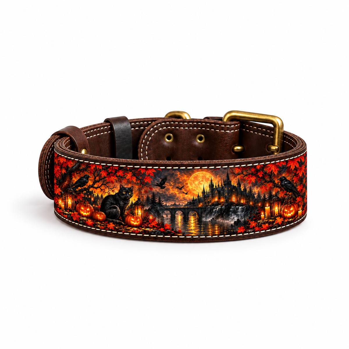 A brown leather dog collar with a detailed Halloween landscape print featuring pumpkins, a cat, a bridge, and a full moon, complete with brass hardware on a white background.