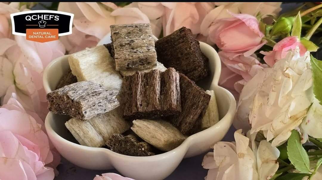 Bowl of dog treats with flowers and a brand logo in the corner