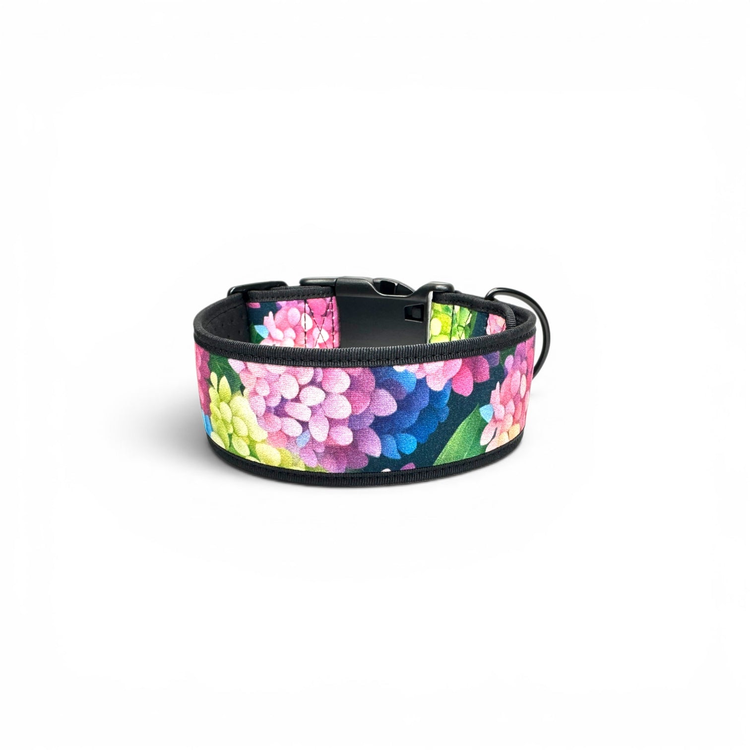 Hydrangea floral dog collar curled to show the black quick-release buckle and wide printed strap.