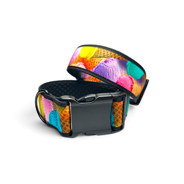 A black buckle strap with a colorful ice cream scoop pattern on a white background.