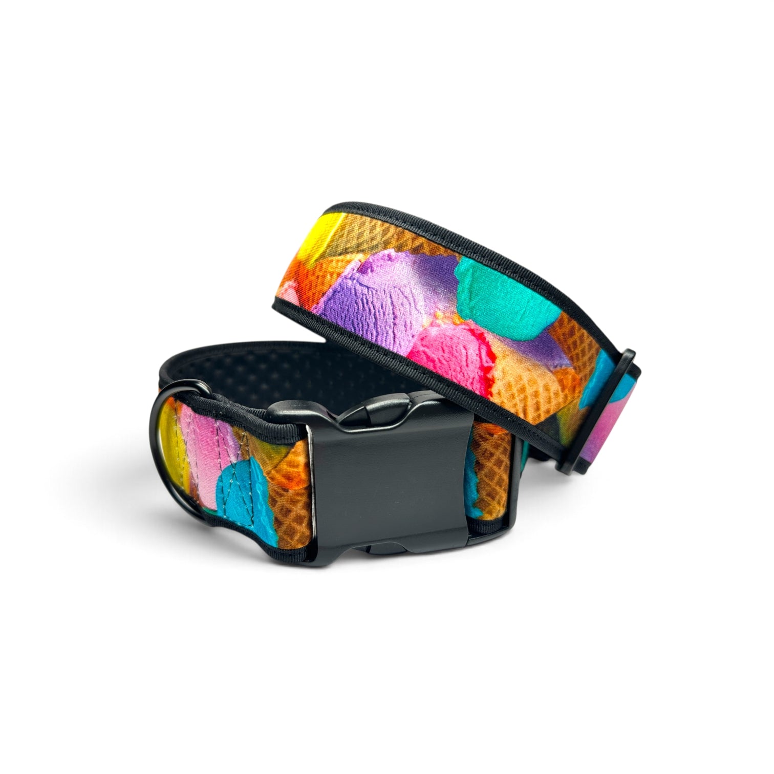 A dog collar with a colorful ice cream scoop pattern on a waffle cone background, featuring a black plastic buckle and black mesh interior, shown on a white background.
