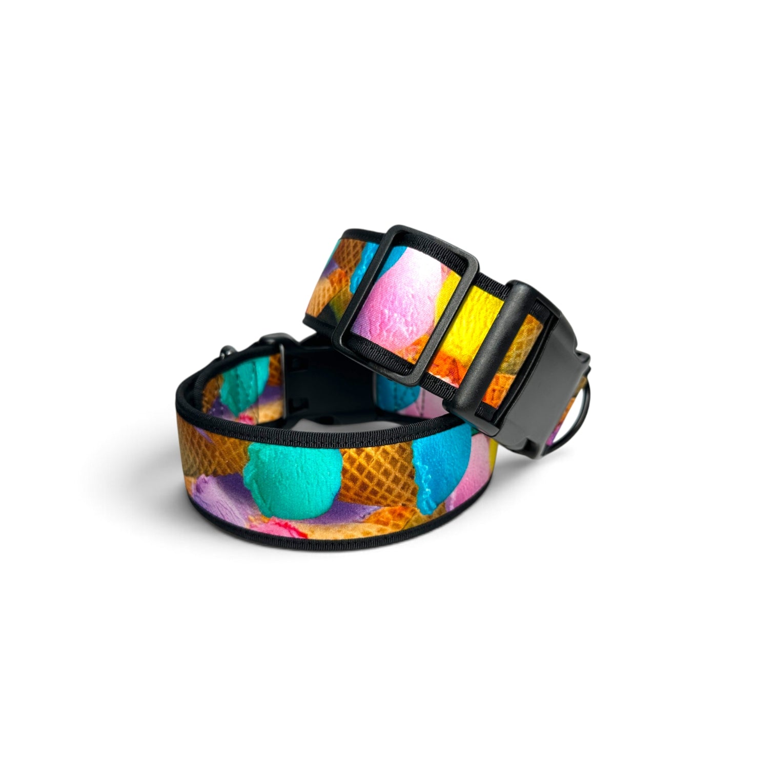 A dog collar with a colorful ice cream cone pattern, featuring black plastic hardware and a black adjustable strap, shown on a white background.